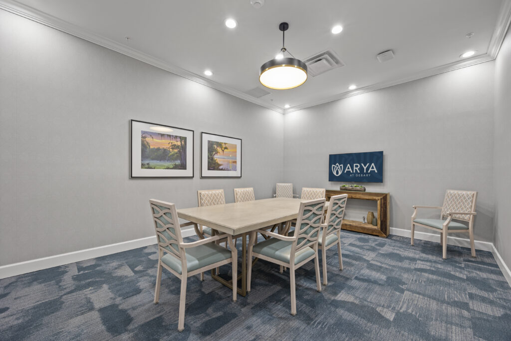 Welcoming community area showcasing colorful seating, elegant lighting, spacious layout, and stylish interior design.