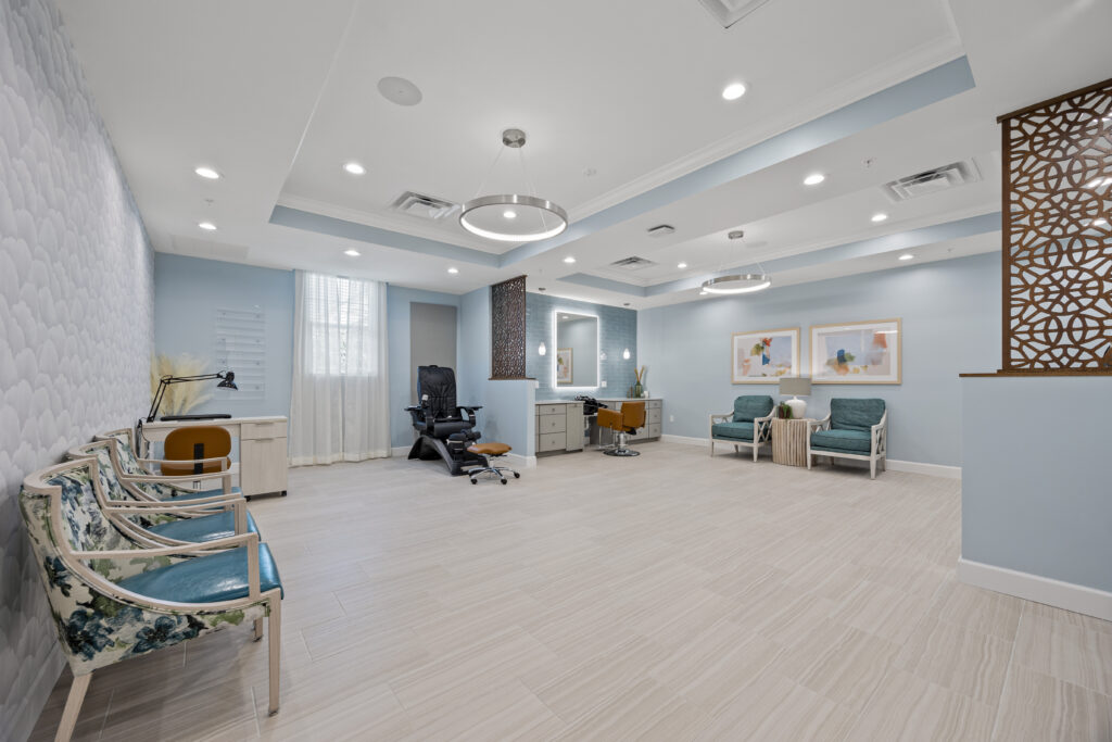 Salon area with calming pastel colors, plush chairs, spacious layout, and comfortable atmosphere.