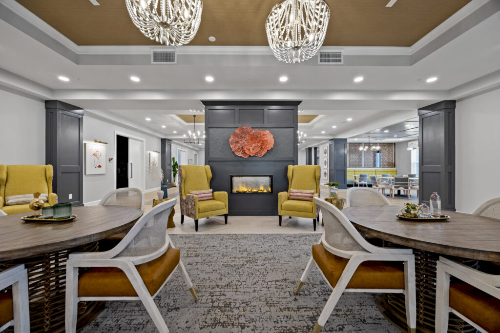 Relaxation area with comfortable couches, stylish wooden shelving, and inviting interior décor.